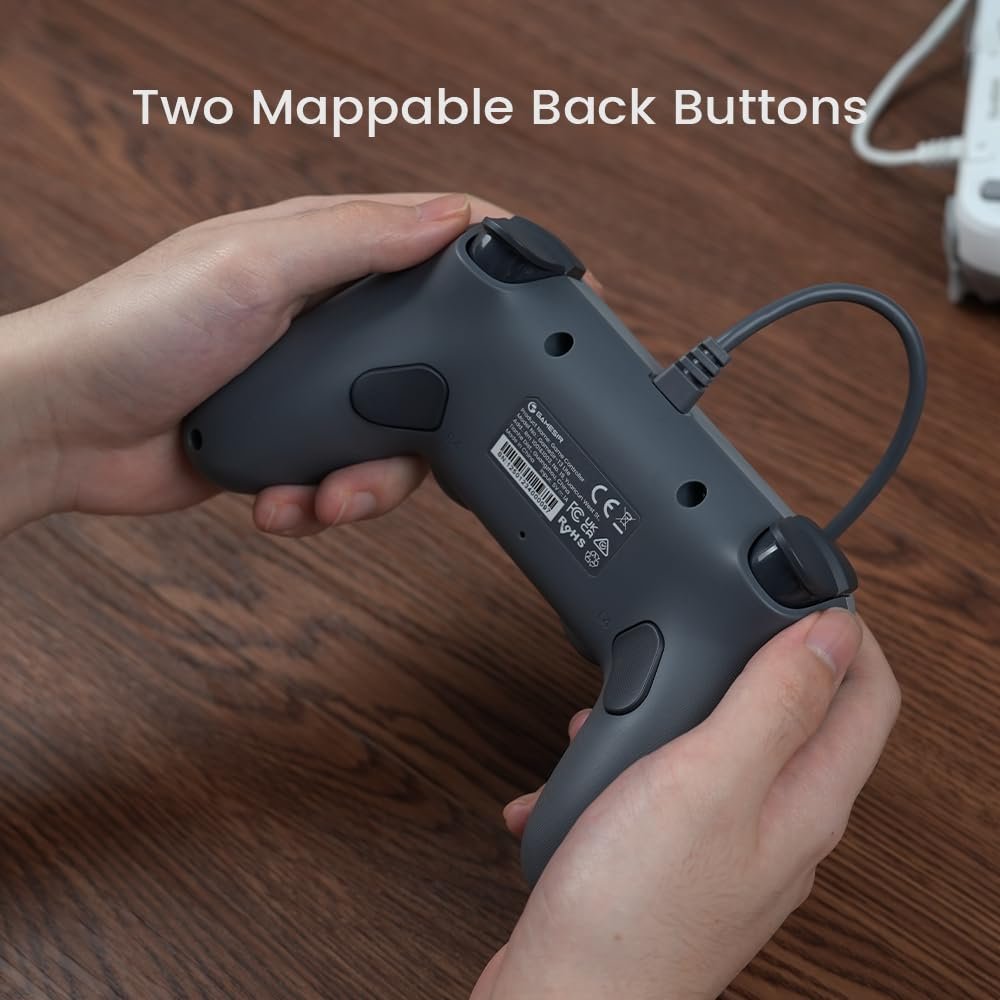 Hands holding a game controller showing two programmable back buttons with the label 'Two Mappable Back Buttons' visible