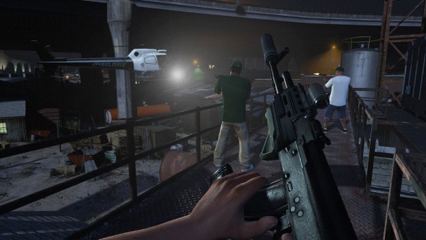 First-person view holding an assault rifle on a metal walkway overlooking a dim industrial yard with a helicopter in the distance at night.