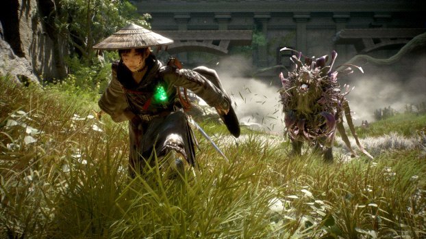 Ninja-like figure with a conical hat runs through tall grass, chased by a spiky purple monster; a bridge appears in the background.